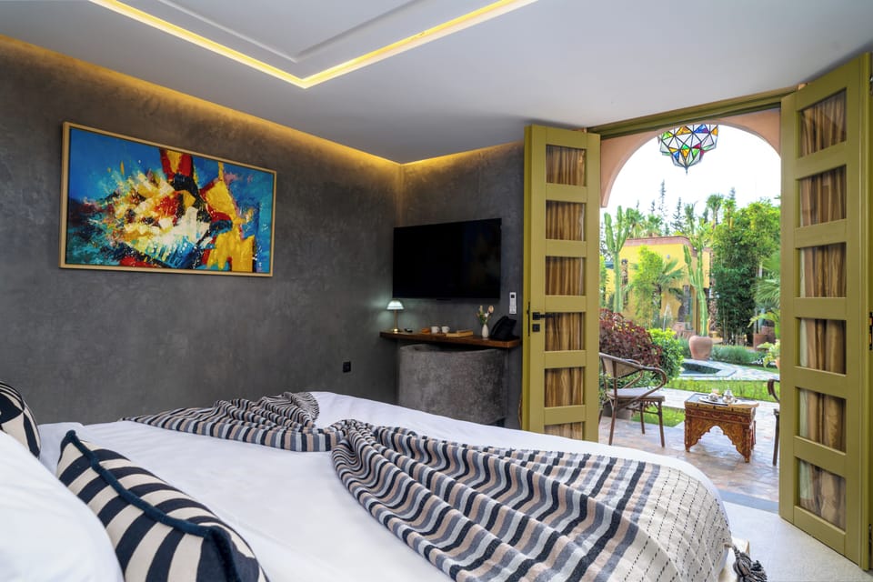Deluxe Double Room, Pool View | Minibar, in-room safe, desk, iron/ironing board