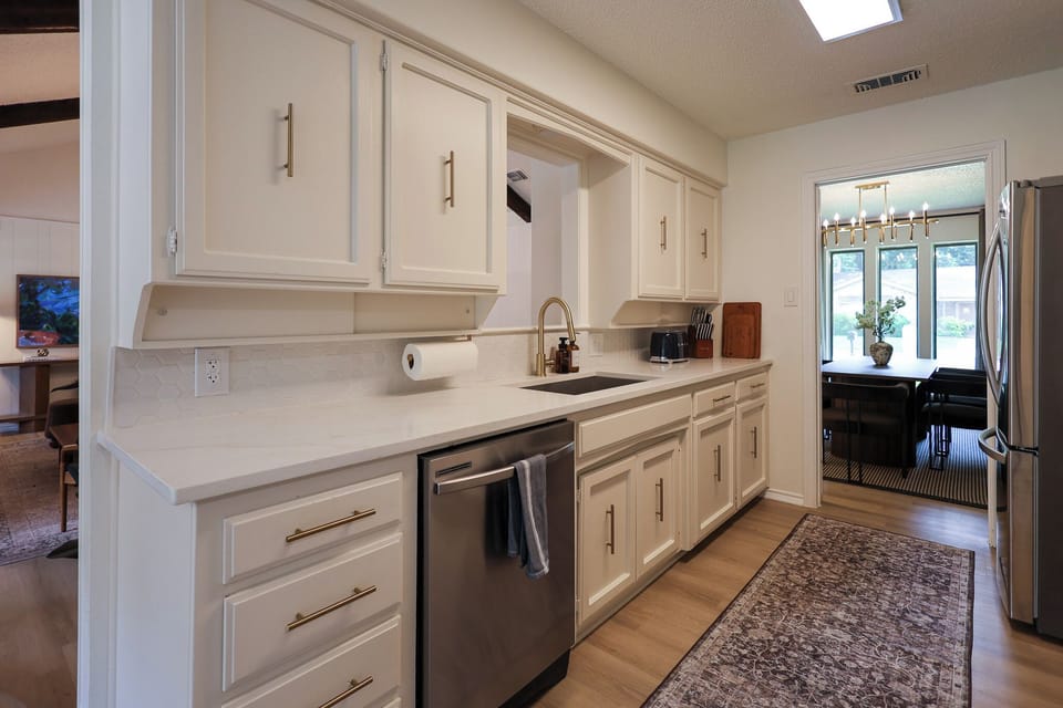 Alley Kitchen with gold finishes fully stocked.