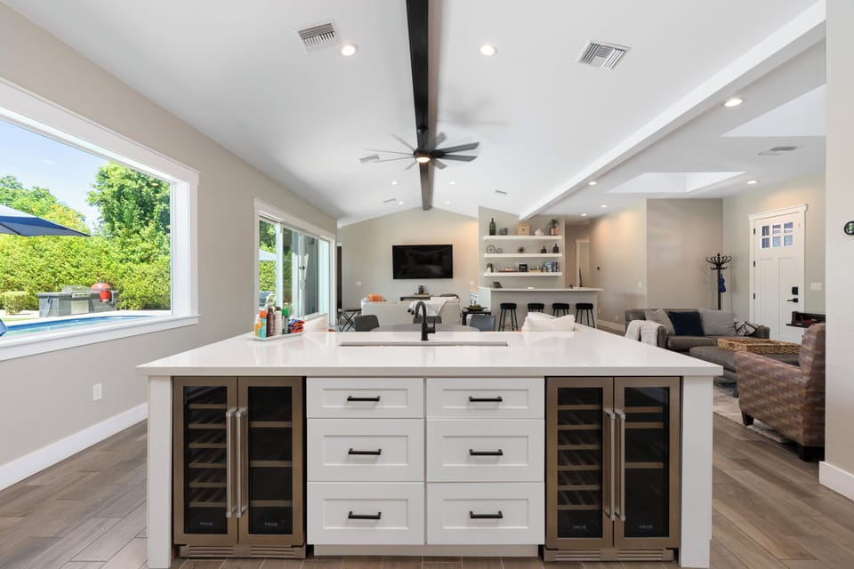 Spacious kitchen island with built-in beverage coolers, perfect for entertaining