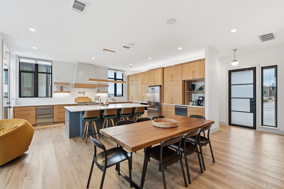 Dining area- 8 dining chairs and 4 barstools at kitchen island