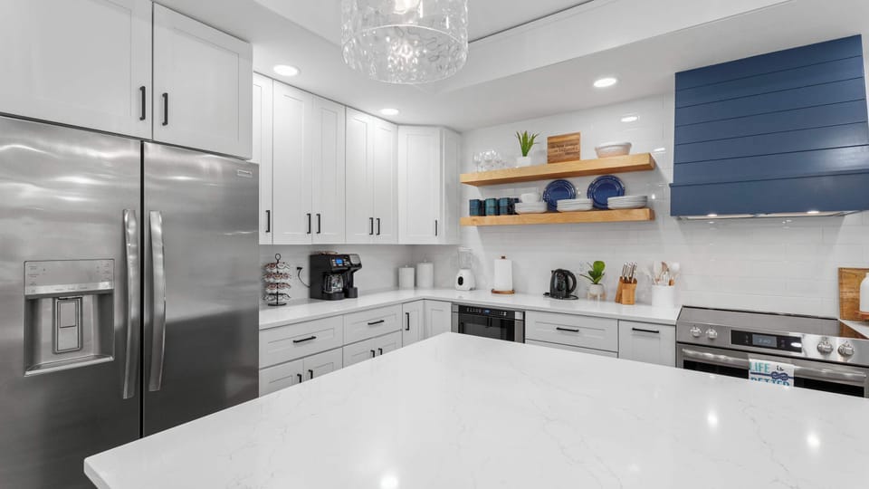 The fully updated kitchen features modern appliances, ample counter space, and all the comforts of home.