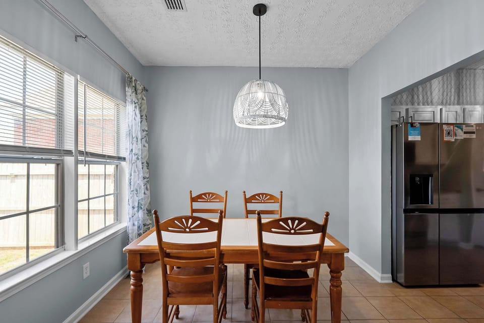 Dining table with seating for shared meals, board games, or planning your Foley and beach day adventures