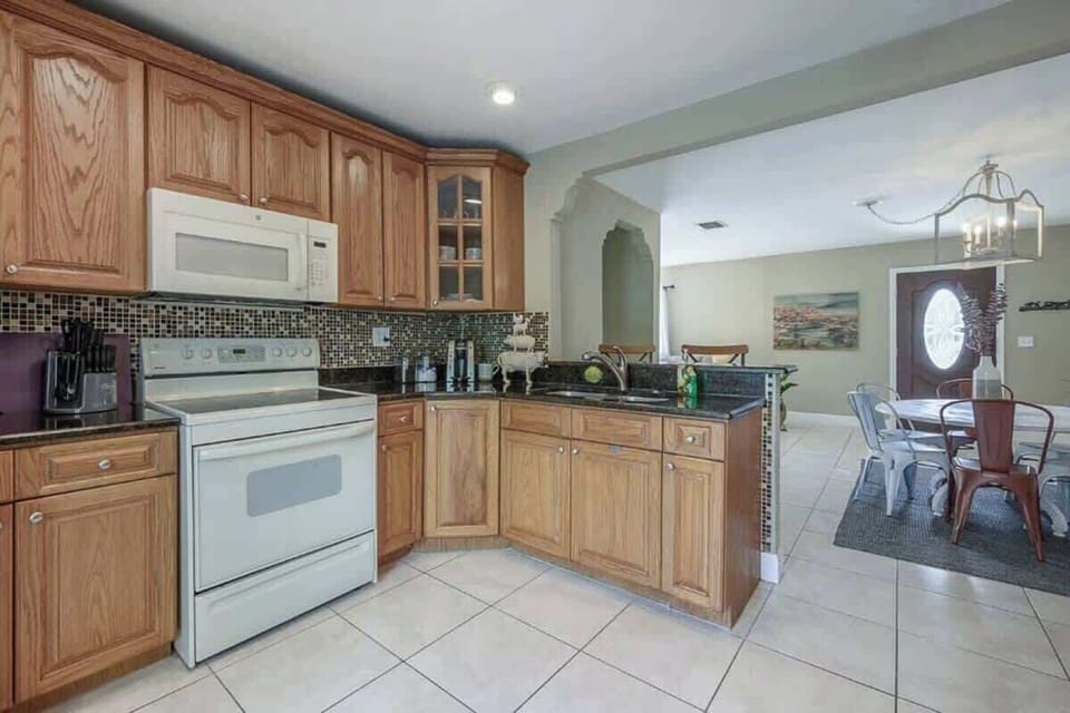 Kitchen Delight: Whip up culinary delights in this bright, spacious kitchen with modern finishes!