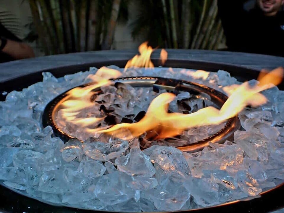 Gas Fire Pit: Ignite unforgettable evenings under the stars with warm flames and refreshing drinks!