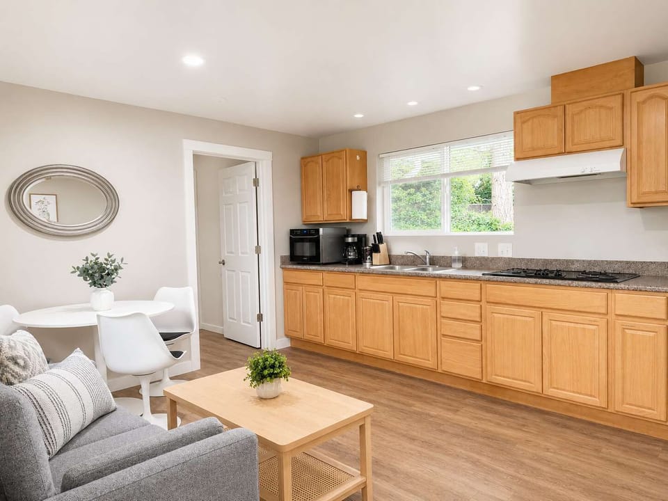 Whip up your favorite meals in a bright, fully-equipped kitchen that flows effortlessly into an inviting space made for casual mornings and lively conversations.
