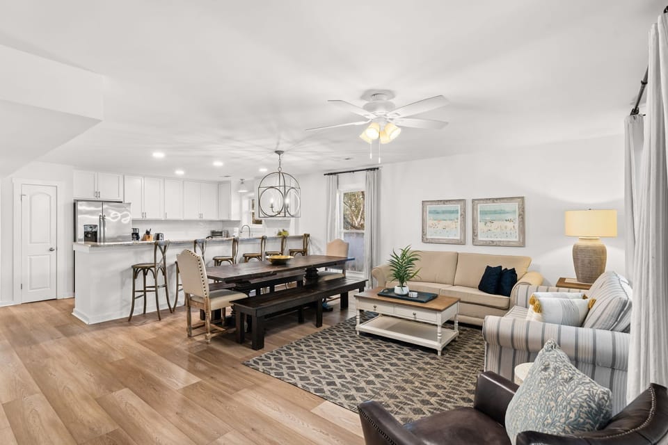 Relax in style! Plenty of comfortable seating, a large Smart TV, and beautiful natural light pouring in.