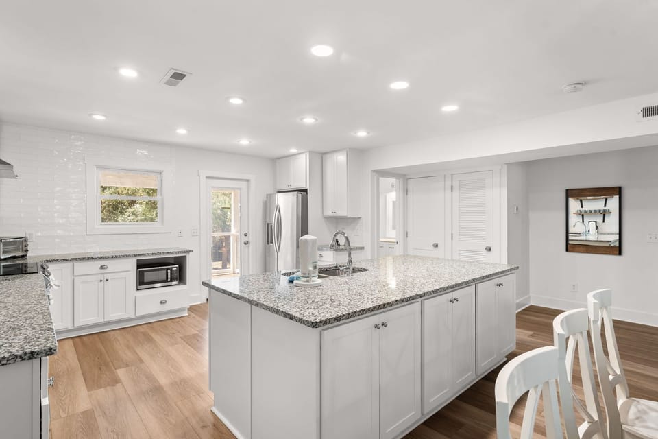 Bright and airy culinary space designed to seamlessly connect with the living areas for easy entertaining.