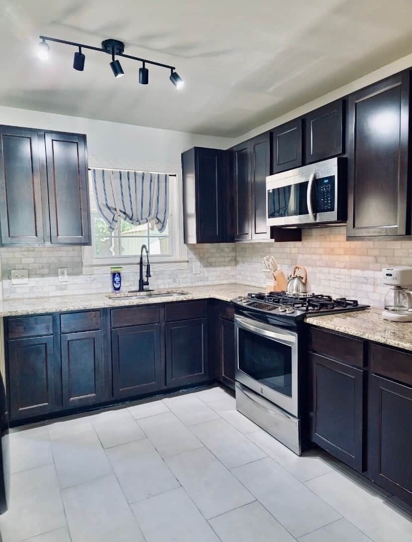 Fully equipped kitchen with modern appliances and ample counter space.