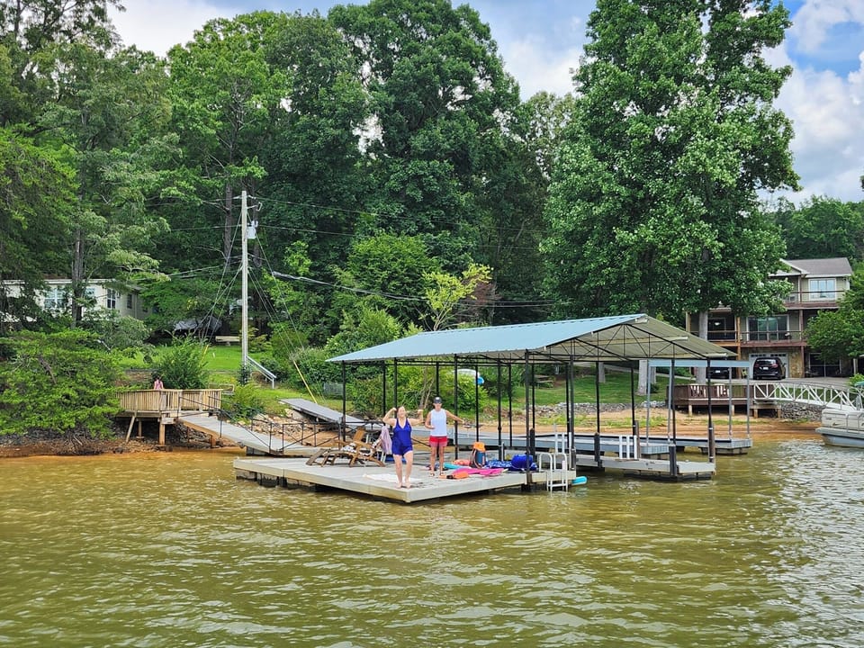 Private dock with 1 covered slip. 321 steps from house!