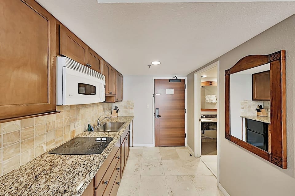 Large counter space, 2 burner stove, microwave, sink, coffee maker,mini fridge