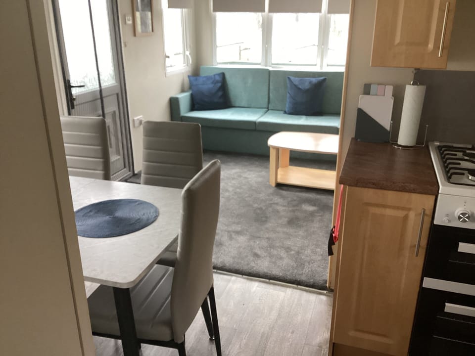 Step inside through one of two entrances into the open-plan living and kitchen area.