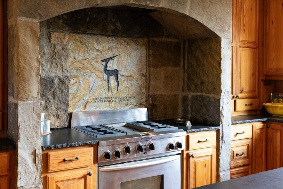 Rustic ranch kitchen with stone accents and lodge-style character
