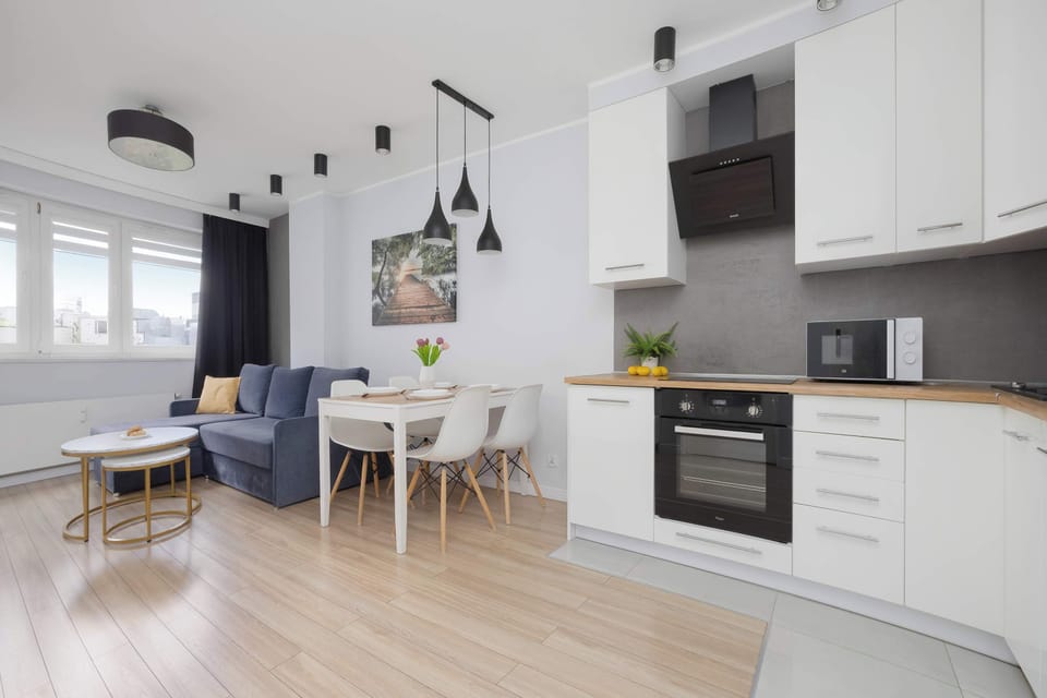 The living room has a modern look and comfortable furniture.