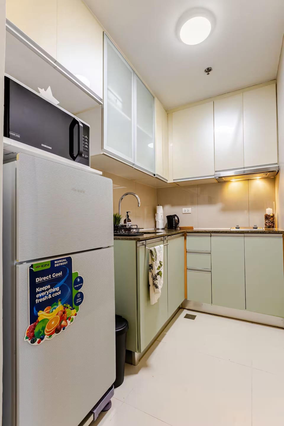 Microwave, refrigerator, toaster, coffee maker, and hot water kettle.