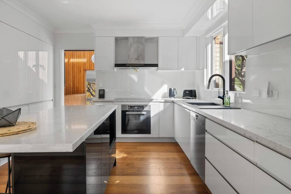Cook with ease in the light-filled kitchen, where modern finishes and generous bench space make family meals feel effortless.
