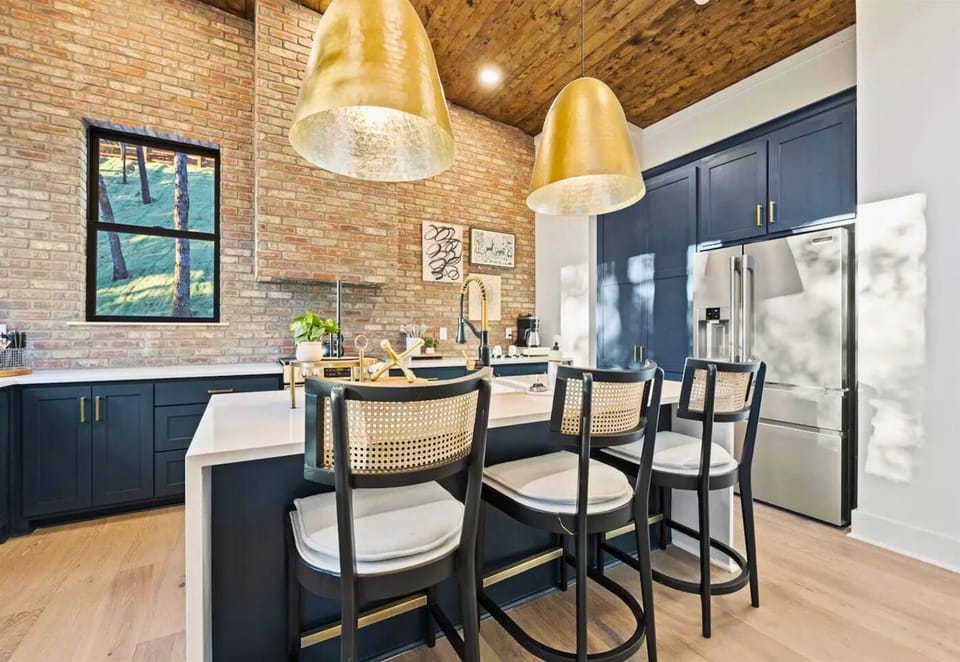Modern meets cozy in this kitchen nook, with thoughtful details that make cooking or just brewing a cup of coffee a delight.