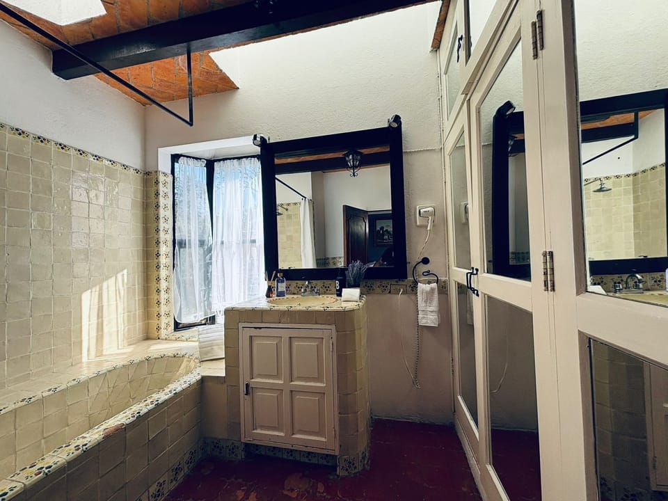 Comfort Suite, 2 Double Beds, Pool View | Bathroom | Hair dryer, towels, soap, shampoo