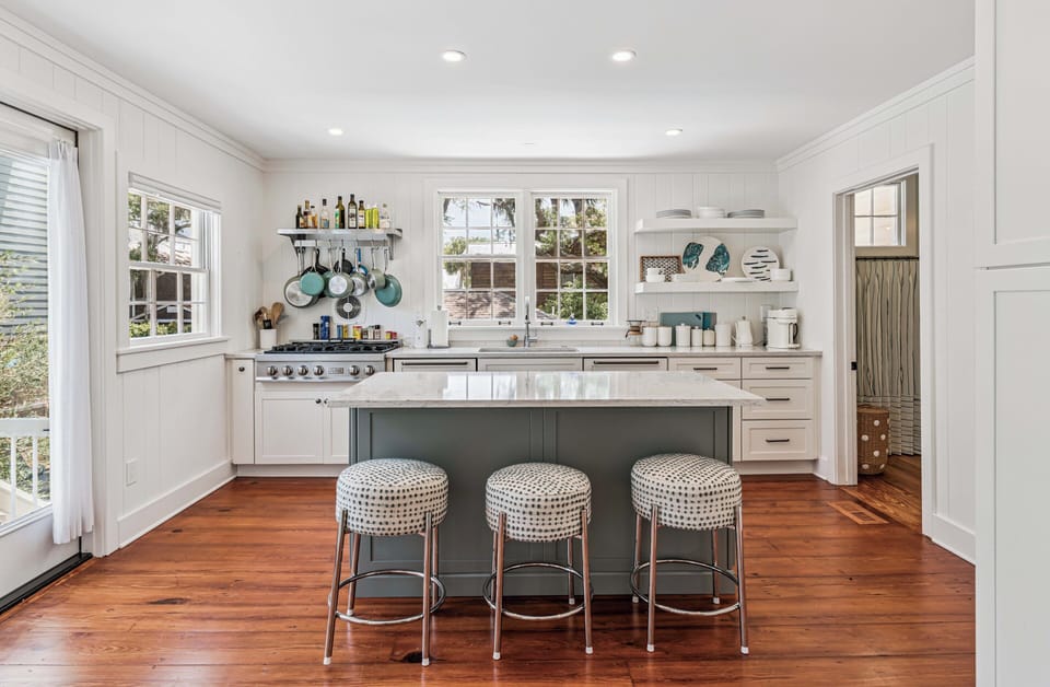 Your bright, fully equipped kitchen invites you to gather at the island, cook with loved ones, and savor meals together in this sun-drenched, charming space.