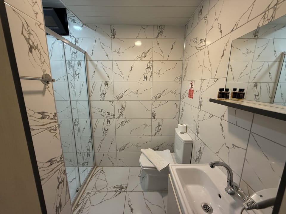 Shower, hair dryer, soap, shampoo