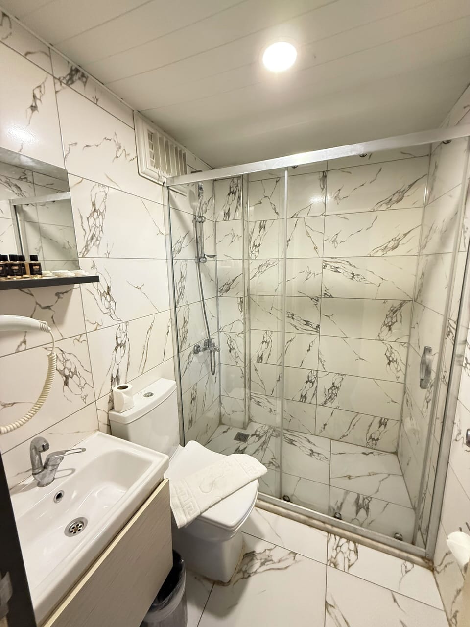 Quadruple Room | Bathroom | Shower, hair dryer, soap, shampoo