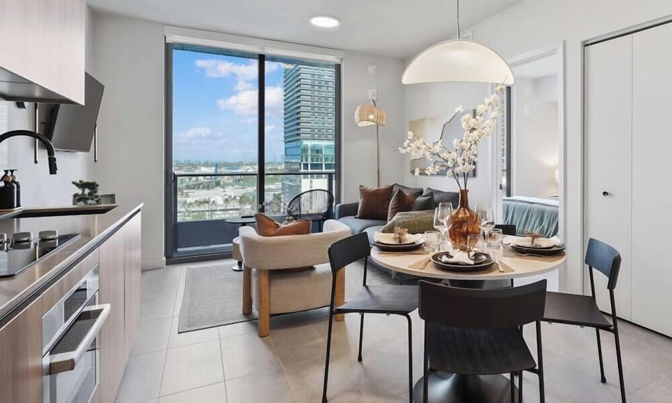 Stylish kitchen and dining area with city views
