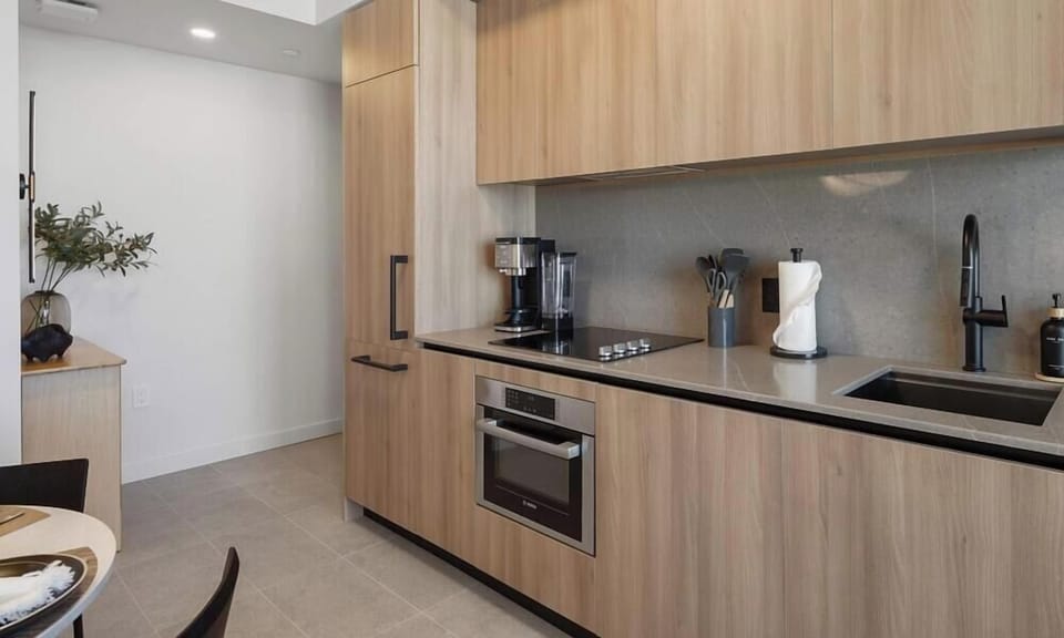 Fully equipped kitchen with modern wood cabinetry