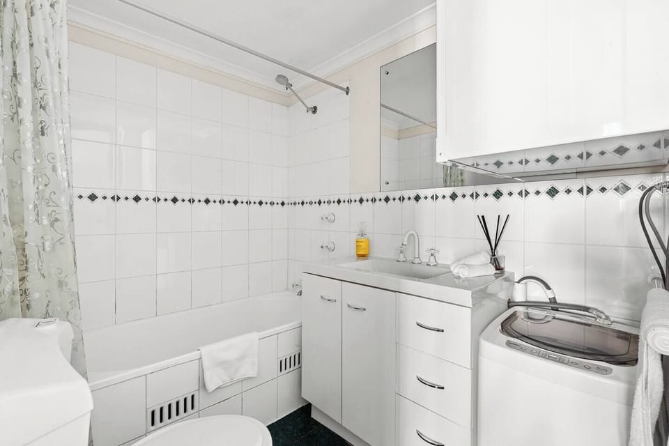 Freshen up with a shower or soak in the bathtub, with the added convenience of a private washing machine for longer stays.