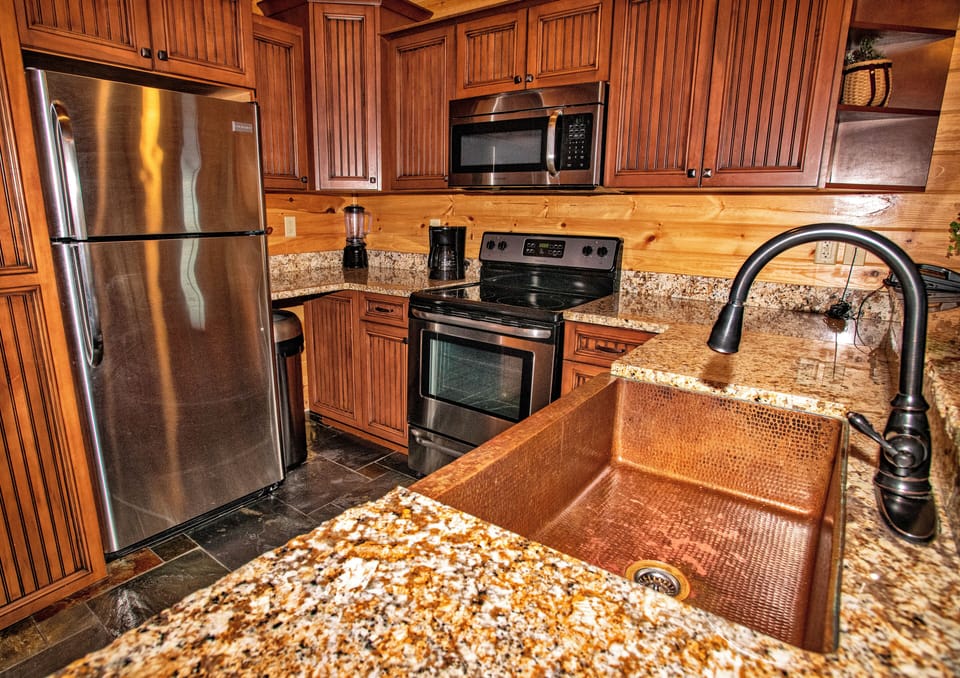 Microwave, coffee/tea maker, cleaning supplies, paper towels