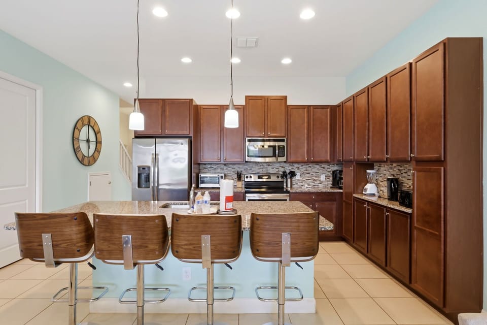 Fully equipped kitchen with granite countertops and everything needed for home-cooked meals.