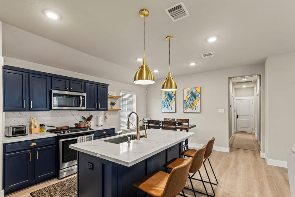 Quartz island with bar seating—perfect for snacks, homework, or happy hour!