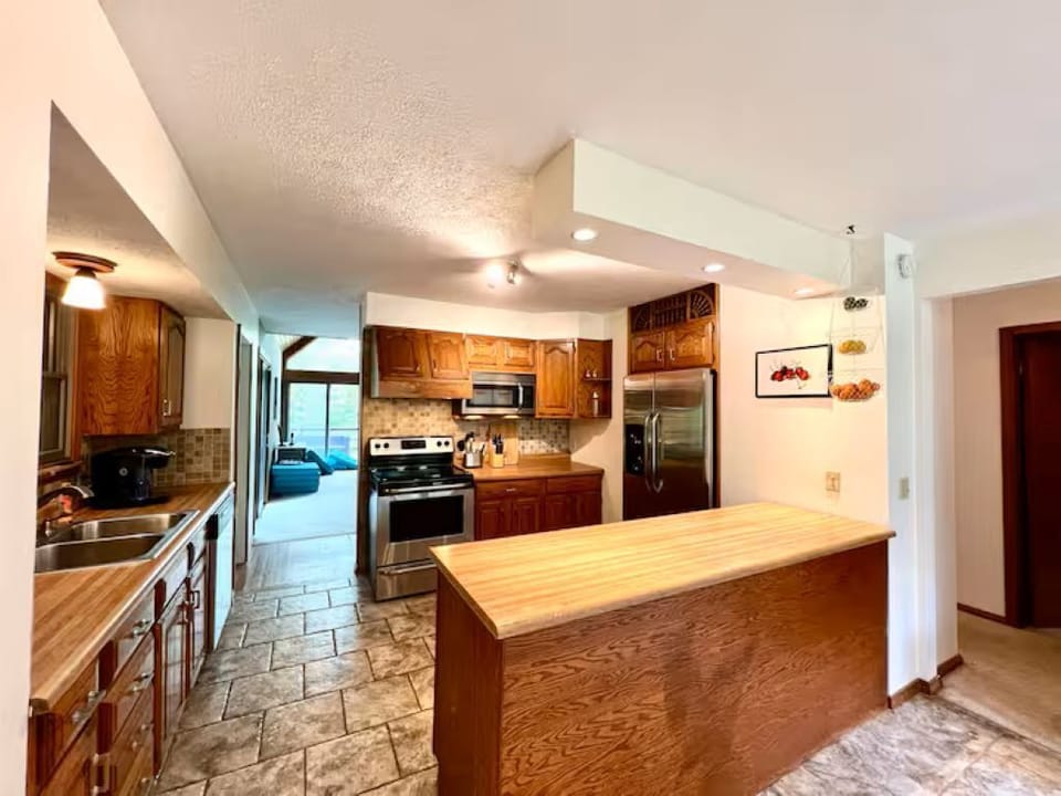 Fully-equipped kitchen with stainless steel appliances