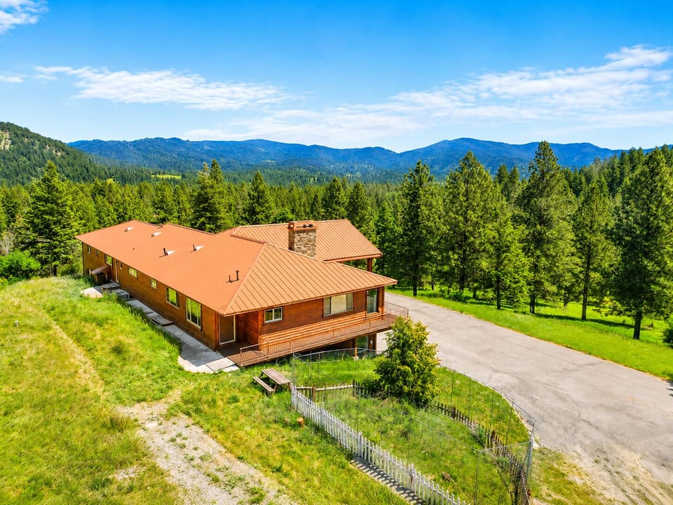 Aerial of the back of the home with views 