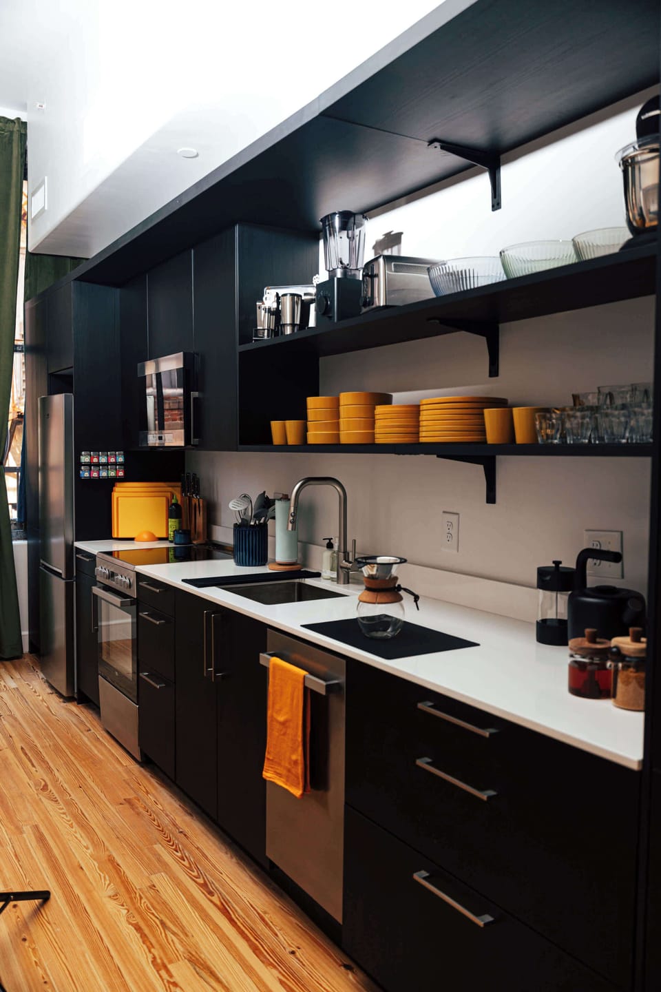 Fully equipped kitchen with dishwasher, open shelving, and everything you need for home-style meals