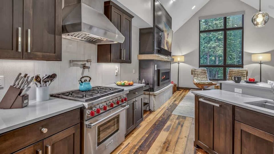 Kitchen: Drip coffee maker, Nespresso, Crockpot, blender, Sub-Zero refrigerator, Wolf oven, Wolf range, Wolf stovetop, Wolf microwave, Asko dishwasher, kitchen island, bar stools, main floor