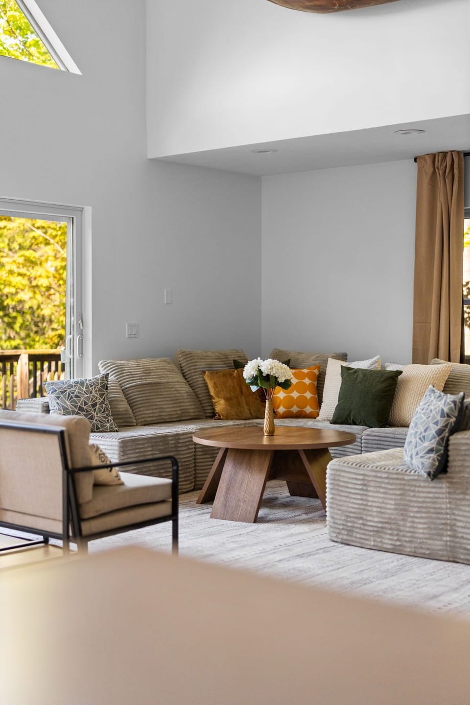 Relax on the sofa and take in the beautiful wooded scenery outside.