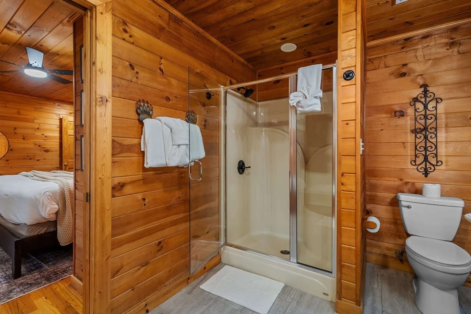 A clean, well-appointed bath with a walk-in shower and thoughtful touches.