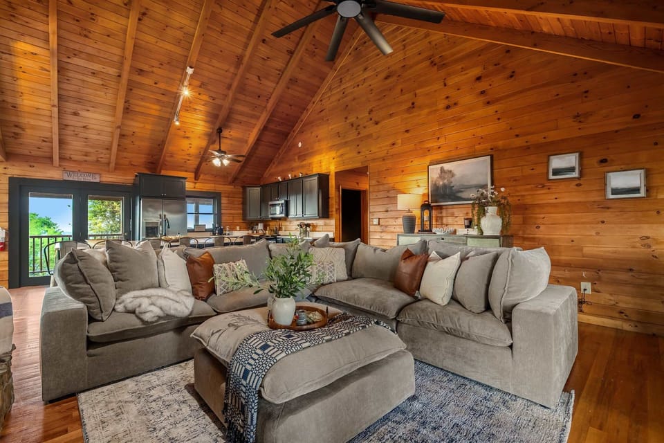 Open, airy, and flooded with light — the living space flows right out to the deck and the view.