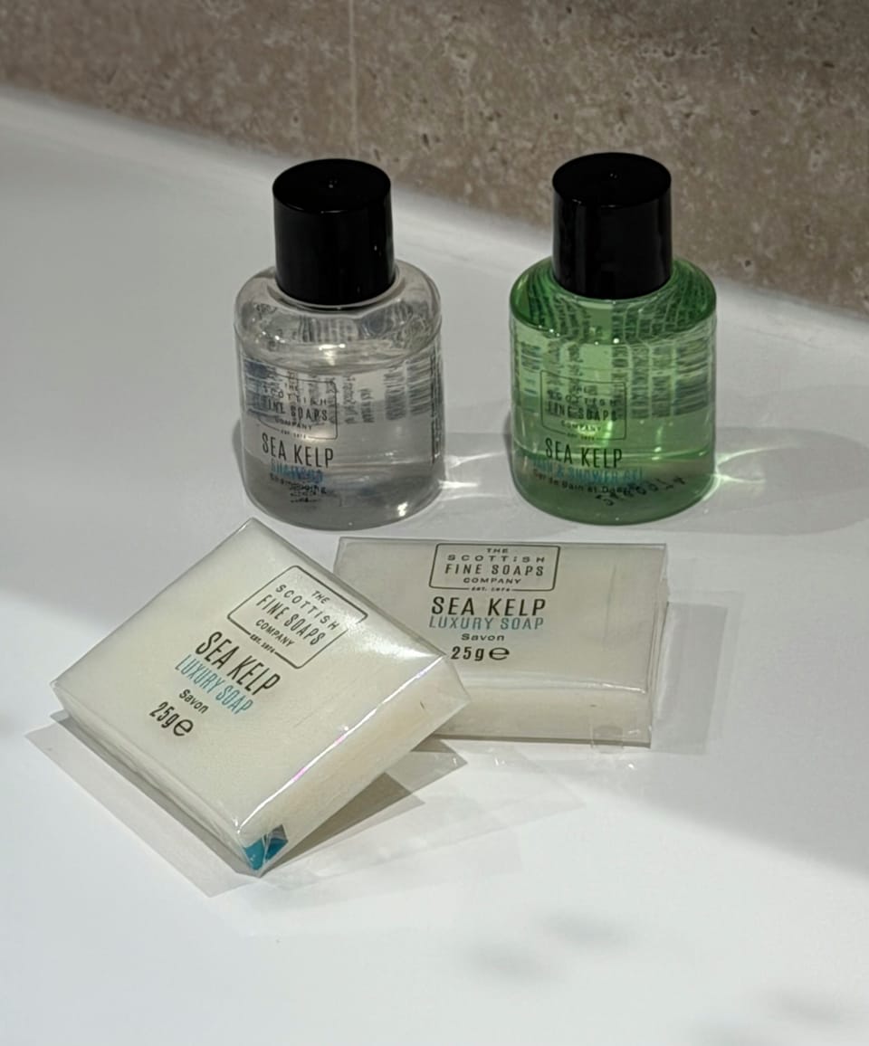 Designer toiletries, hair dryer, towels, soap
