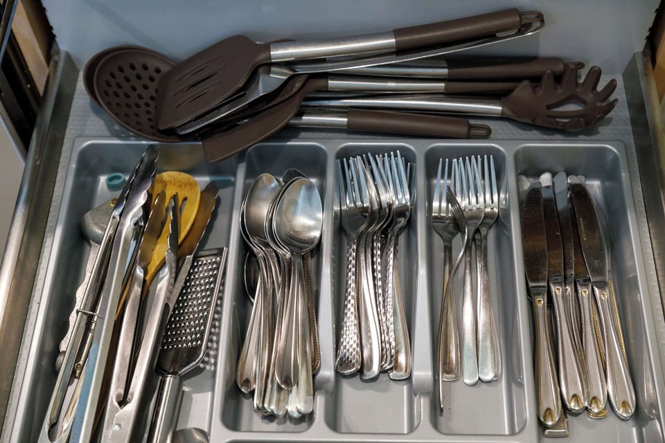 Lots of silverware and utensils.