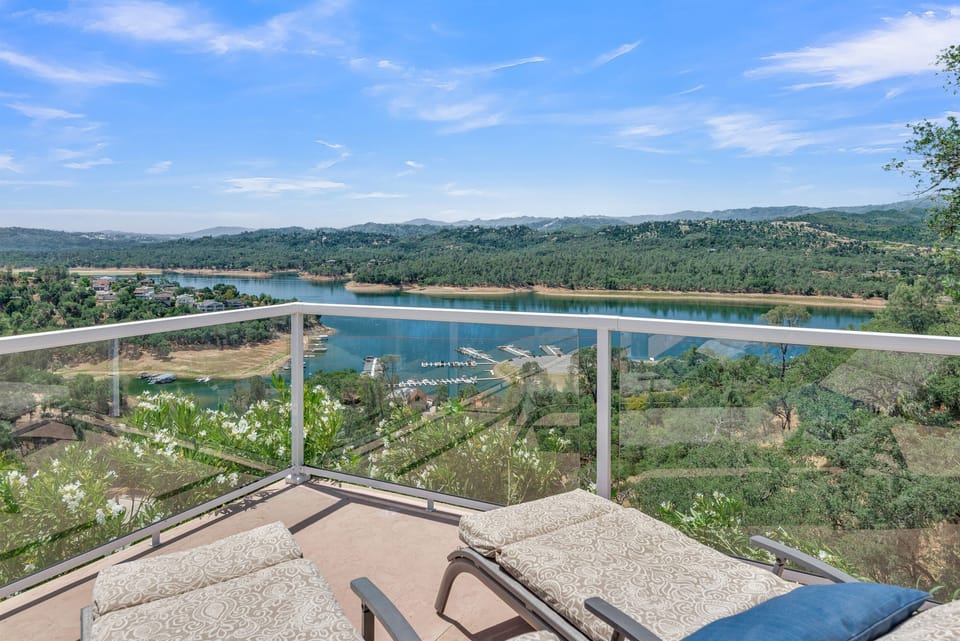 Glass railings create uninterrupted panoramic views from every seat on the deck.