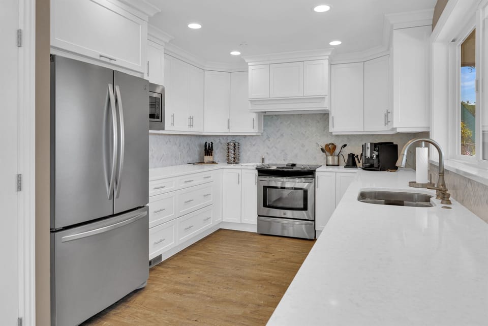 Prepare meals while still enjoying lake views and staying connected with family in the open-concept living space.