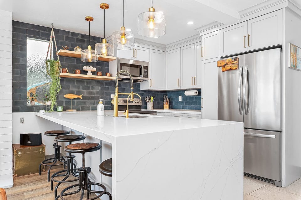 Stylish kitchen with modern finishes and everything needed for a beachside stay
                