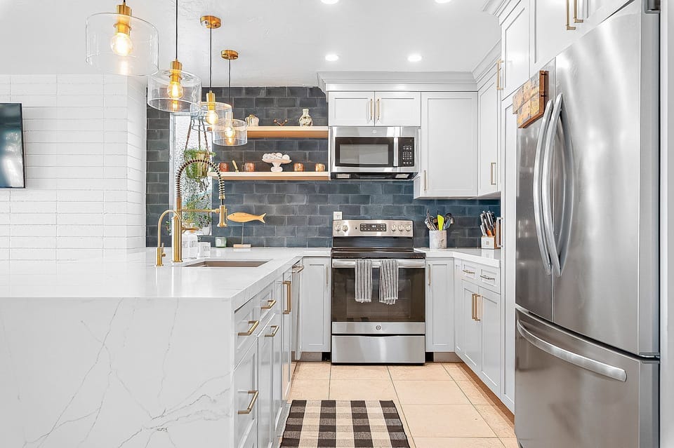 Open-concept kitchen with bar seating and seamless flow into the living area
                