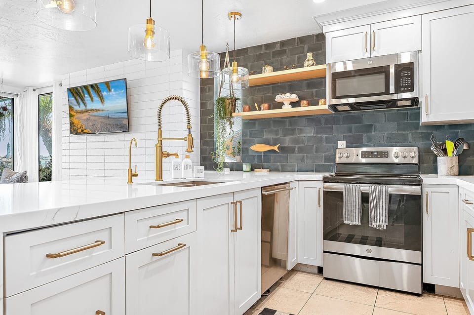 Open-concept kitchen and living area designed for effortless bayfront gatherings
                