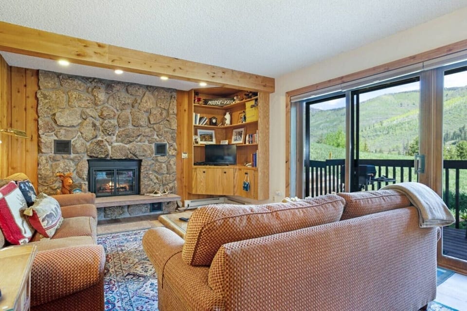 Panoramic valley views and natural light define this inviting mountain retreat