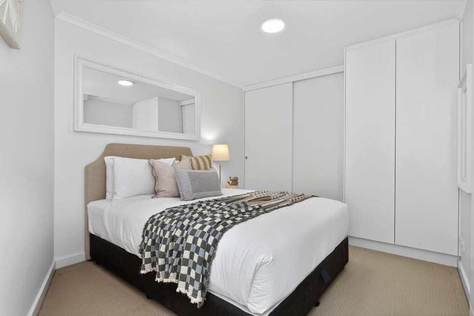 Cosy queen bedroom with built-in wardrobe