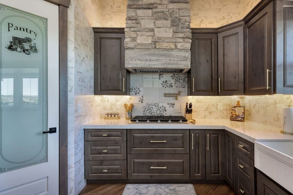 Luxury cabinetry, designer tilework, and upscale finishes create a kitchen that is both beautiful and functional.