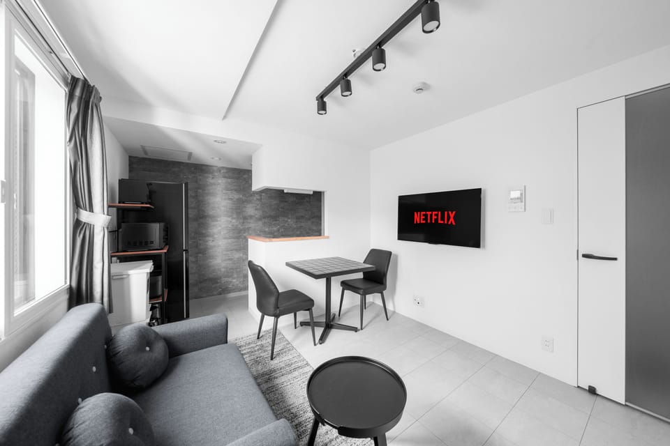 Apartment | Living area | 43-inch flat-screen TV with digital channels