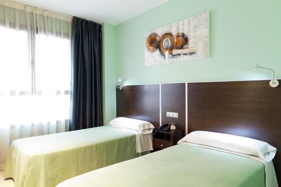 Twin Room | Premium bedding, down comforters, desk, WiFi (free)