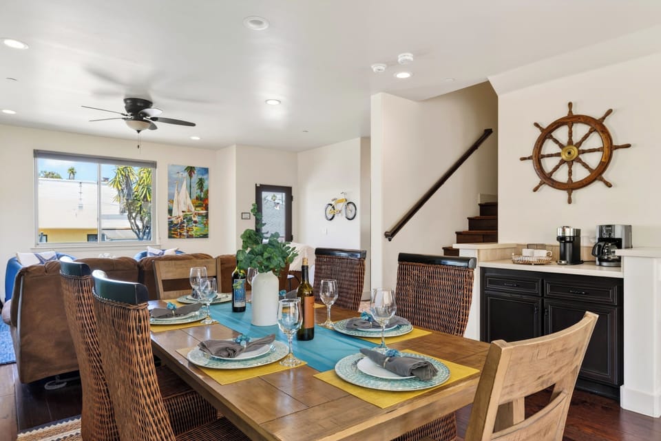 The formal dining table is perfect for hosting dinner parties, complete with a stylish nautical-themed accent piece.